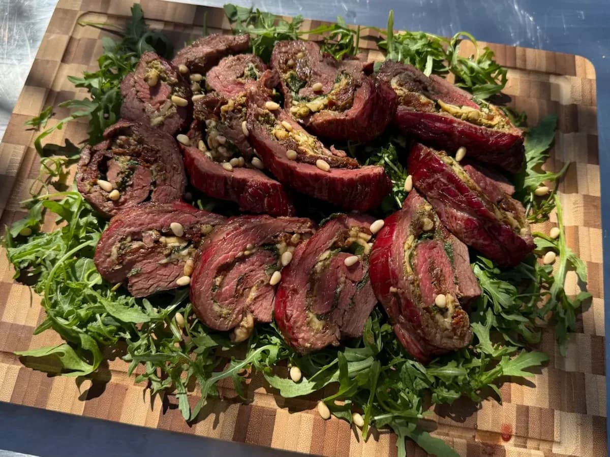 Bavette carpaccio roulade with pesto, rocket, Parmesan and pine nuts