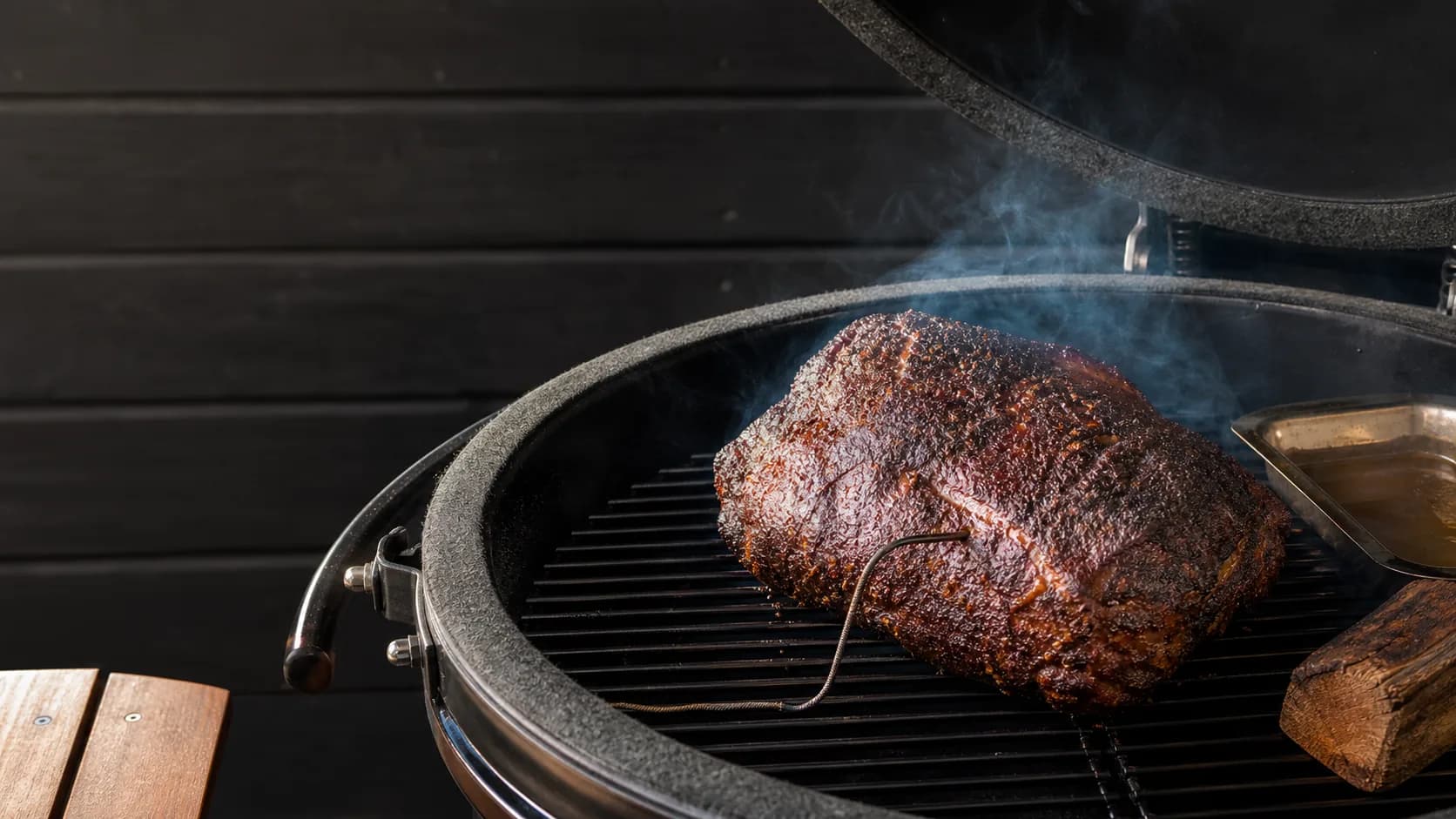 Low and slow BBQ with smoke, bark and thermometer probe